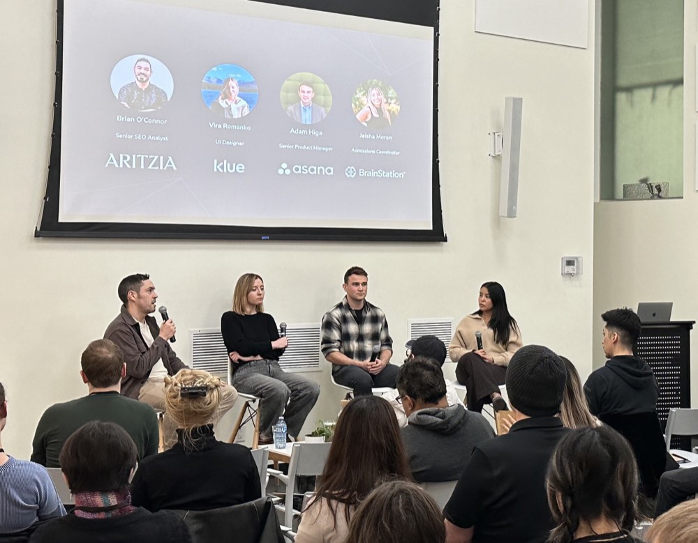 Brian O’Connor speaking with fellow panelists at a BrainStation event.